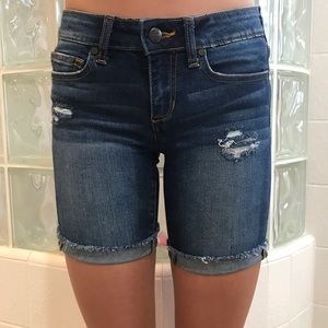 Dark denim shorts.